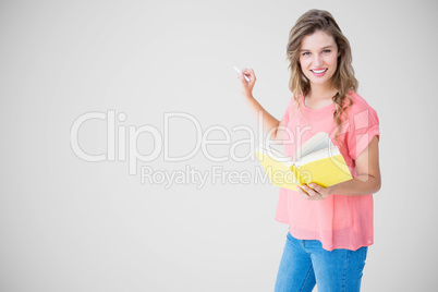 Composite image of hipster woman holding book Composite image of hipster woman holding book