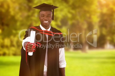 Composite image of man smilling at graduation