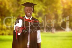 Composite image of man smilling at graduation