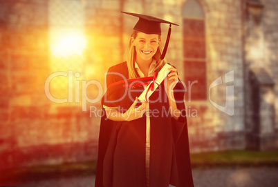 Composite image of woman smiling at her graduation