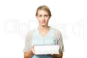 Composite image of teacher holding books