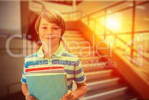 Composite image of cute pupil smiling at camera in library