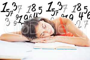 Composite image of sleeping student head on her books