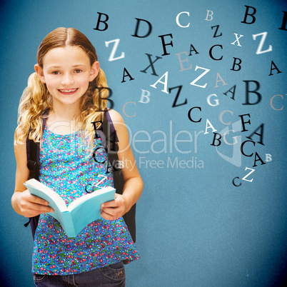 Composite image of cute little girl reading book in library