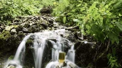 beer cooled in waterfall spring