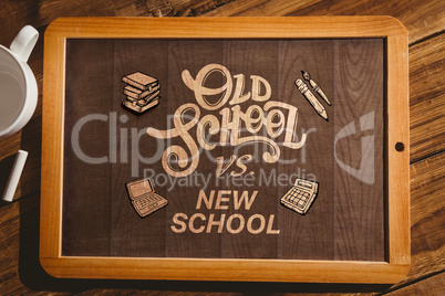 Composite image of chalkboard on desk