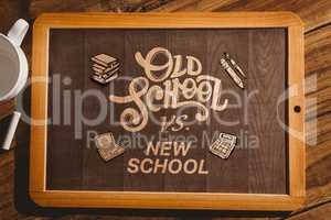 Composite image of chalkboard on desk