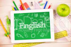 English against students desk with tablet pc