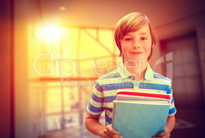 Composite image of cute pupil smiling at camera in library