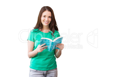 Composite image of student picking a book from shelf in library