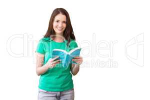 Composite image of student picking a book from shelf in library