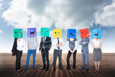 Composite image of people with boxes on their heads