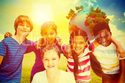 Composite image of happy children forming huddle at park