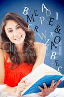 Composite image of portrait of a beautiful student reading a blu