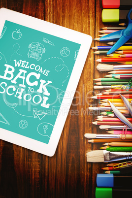 Composite image of back to school written on chalkboard