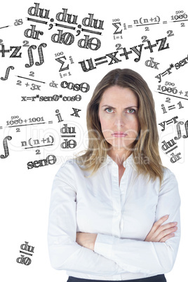 Composite image of businesswoman looking sad with her arms cross