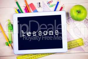 Lessons against students table with school supplies