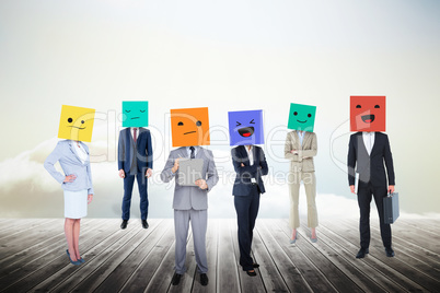 Composite image of people with boxes on their heads