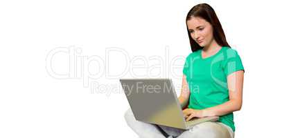 Composite image of student sitting on floor in library using lap