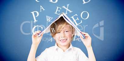 Composite image of cute pupil holding books
