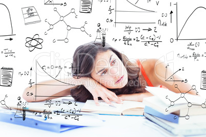 Composite image of bored female student doing her homework