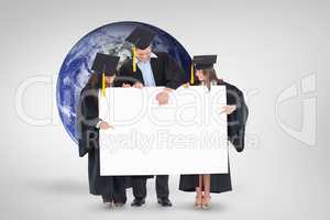 Composite image of three graduates pointing to the blank sign