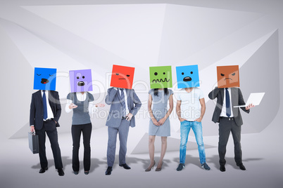 Composite image of people with boxes on their heads