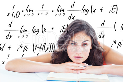 Composite image of frowning student head on her books