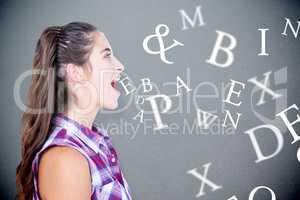 Composite image of a pretty brunette woman screaming