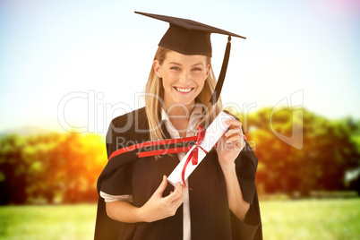 Composite image of woman smiling at her graduation