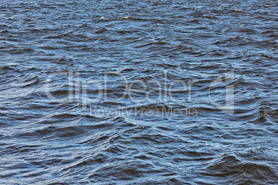 waves on the river close-up as background