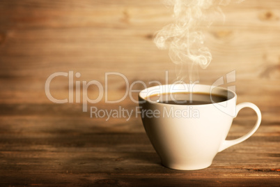 Steaming coffee in white mug