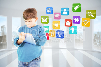 Composite image of cute boy using tablet