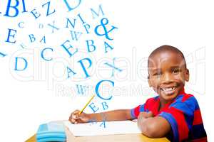 Composite image of happy pupil at desk