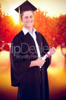 Composite image of a smiling man looking at the camera as he gra