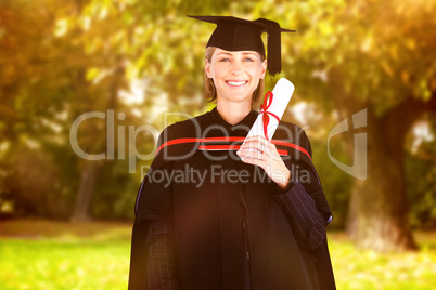 Composite image of happy attractive graduate