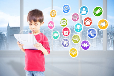 Composite image of cute boy using tablet