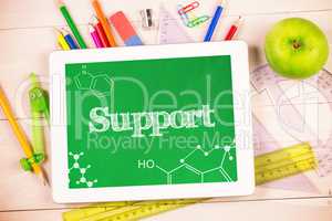 Support against students desk with tablet pc