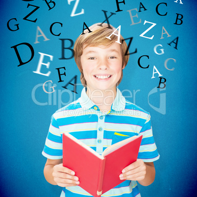 Composite image of cute pupil smiling at camera in library