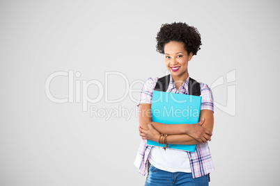 Composite image of casual young woman with folder in office