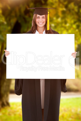 Composite image of full length of a woman holding a blank sheet