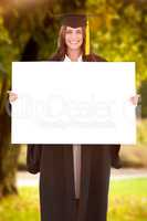 Composite image of full length of a woman holding a blank sheet