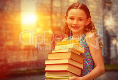 Composite image of cute little girl carrying books in library