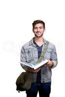 Composite image of student smiling at camera in library