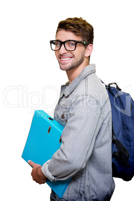 Composite image of student smiling at camera in library