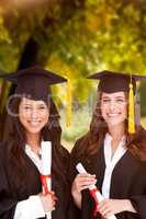 Composite image of two friends stand together after graduating