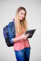 Composite image of student using tablet in library