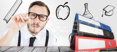 Composite image of geeky businessman writing with marker