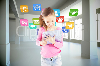 Composite image of cute girl using tablet