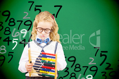 Composite image of pupil holding abacus at elementary school